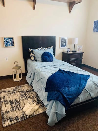Cozy private resident room with blue accents