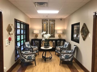 A cozy common area with comfortable seating and decor.