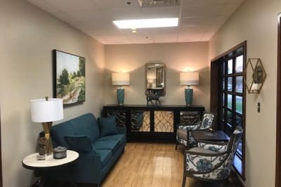 Cozy lounge area with seating and decorative lamps