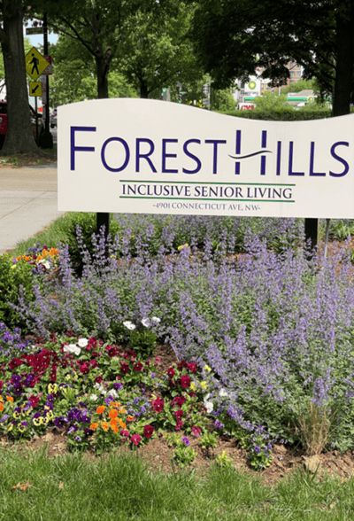 Sign for Forest Hills Senior Living with flowers