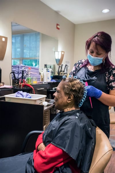 A resident getting their hair done in a salon.