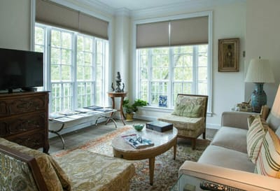 Bright and cozy common area with seating and natural light