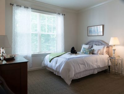 Cozy resident room with a bed and natural light