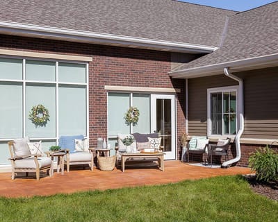 Outdoor seating area with comfortable furniture and decorations