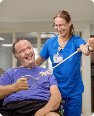 Staff member assisting a resident in an activity