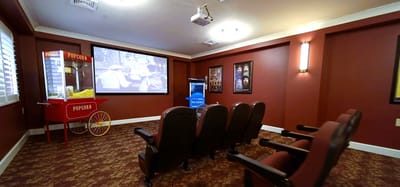 An interior view of a movie room with seating