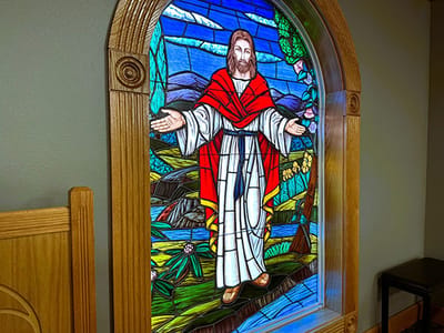 Stained glass window depicting a religious figure