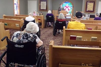 Residents attending a service in a chapel