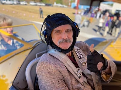 Landmark Nursing & Rehabilitation Ctr of West Mon, Nursing Home in West Monroe, LA — Senior man in pilot gear giving a thumbs-up
