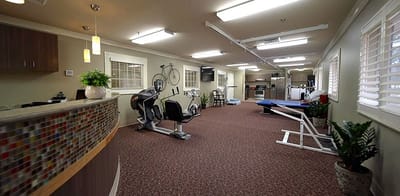 Interior view of a rehabilitation area with exercise equipment