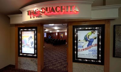 Entrance to a theater area with movie posters