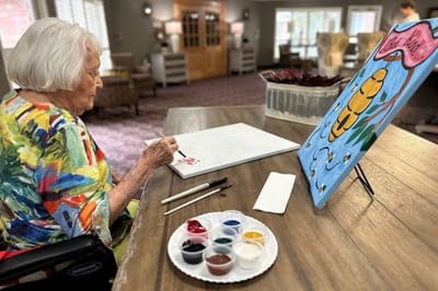Landmark Nursing & Rehabilitation Ctr of West Mon, Nursing Home in West Monroe, LA — Senior resident painting at a table with art supplies