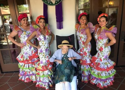 Residents enjoying a celebration with performers