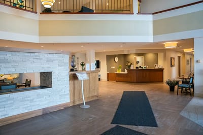 Bright lobby area with seating and front desk