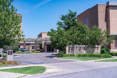 Entrance view of the assisted living facility with landscaping