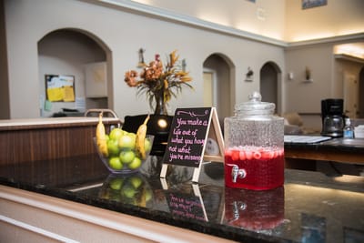 A cozy lobby area with refreshments and decor