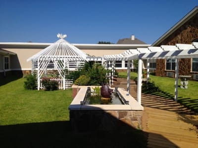 Outdoor garden area with a gazebo and fountain
