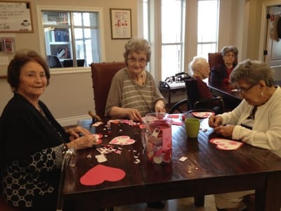 Seniors engaged in an arts and crafts activity