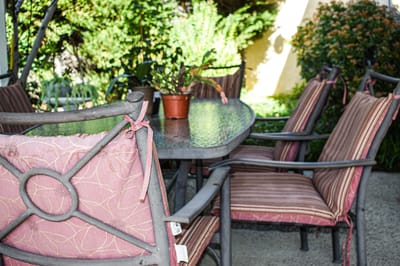 Outdoor patio seating area with a table and chairs