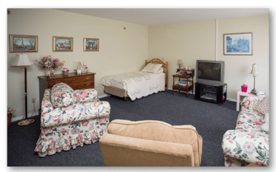 Cozy resident room with floral decor and furniture