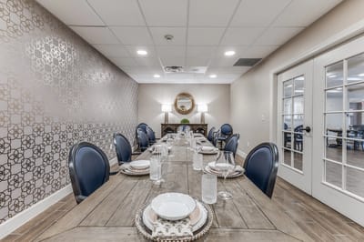 A stylish dining room setup with a long table