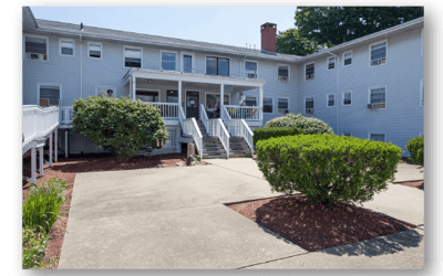 Exterior view of Gabriel House with residents on the porch