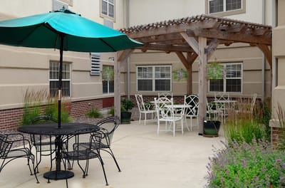 Outdoor seating area with tables and umbrellas