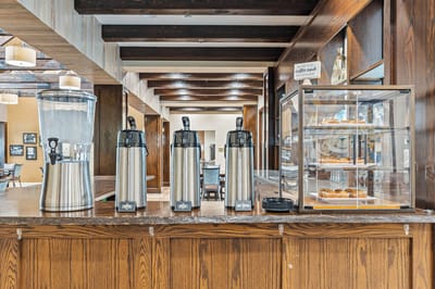 Coffee and pastries displayed in a dining area