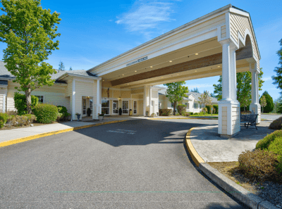 Entrance of a senior living facility with a covered portico