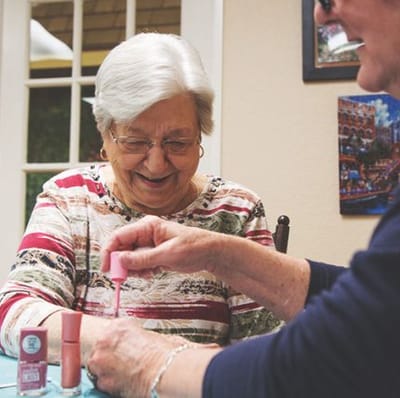 Residents enjoying a nail painting activity together