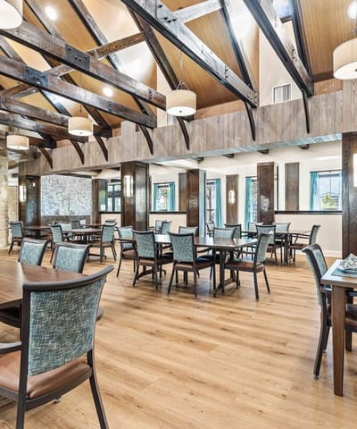 Bright dining area with wooden beams and tables
