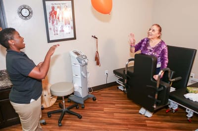 Residents and staff engaging in an activity indoors