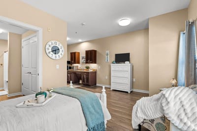 Cozy resident room with kitchen area and amenities