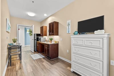 A kitchenette in a resident room with modern furnishings