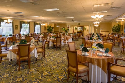 Elegant dining room setup with tables and chairs