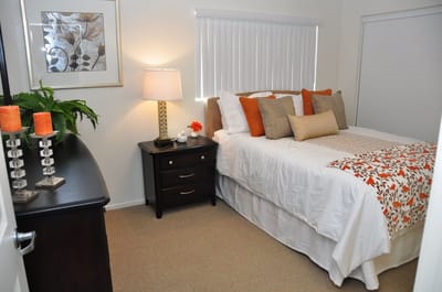 Cozy private resident room with bed and decor