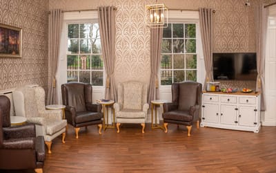 Cozy common area with comfortable seating and windows