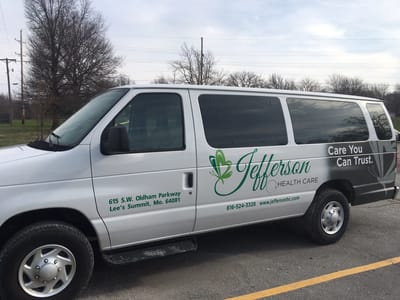 Facility transport van parked outside