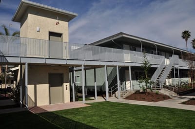 Exterior view of the assisted living facility showing landscaping