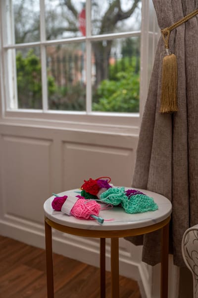 Lound Hall Nursing Home, nursing home — Colorful knitted flowers on a small side table