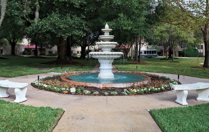 Fountain surrounded by flower beds in a garden