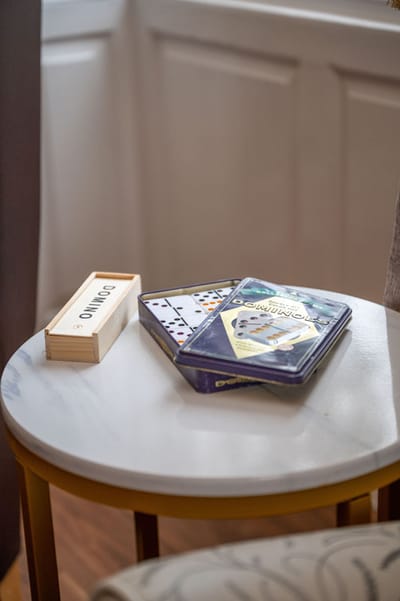 Board games laid out on a small table in a cozy room