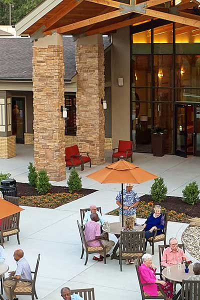 Residents enjoying time outdoors in a garden area