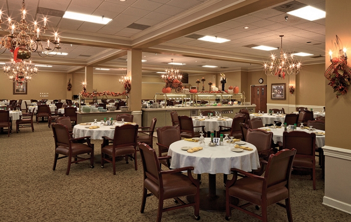 Dining room with tables set for residents