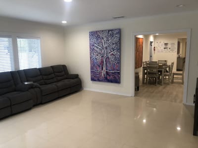 Spacious common area with comfortable seating and art