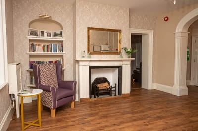 Cozy common area with bookshelves and seating