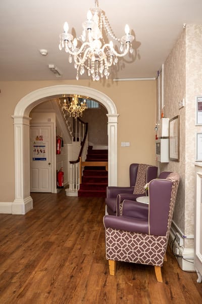 Common area with seating and chandelier