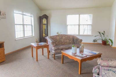 Bright common area with seating and plants