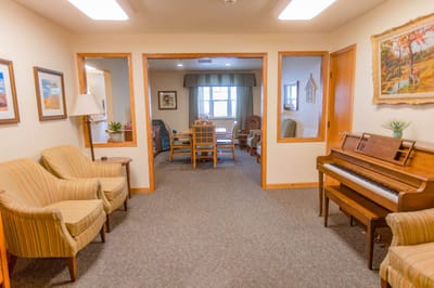 Common area with comfortable seating and a piano