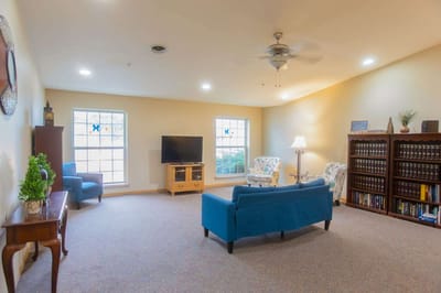 Bright, spacious common area with seating and entertainment
